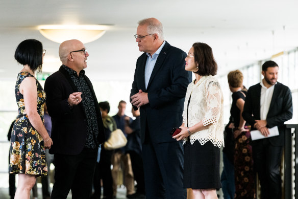 Scott Morrison (centre) and Gladys Liu (right) talk with Syndal Baptist Church pastor Chris Danes on Good Friday.