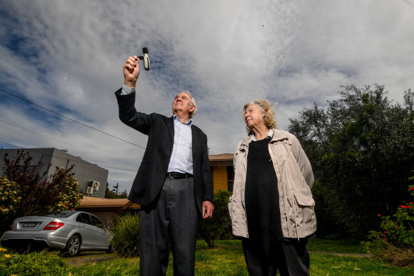 John and Susan Jennison look at a noise level monitor at their Keilor home.