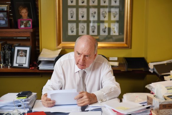 Alan Jones at his desk, where he looks through email correspondence and research.