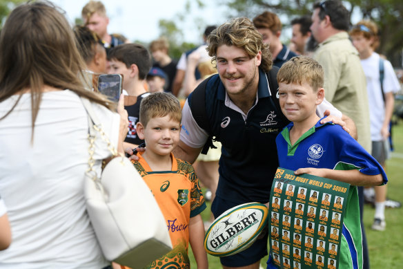 Fraser McReight poses for a photo with some young fans.