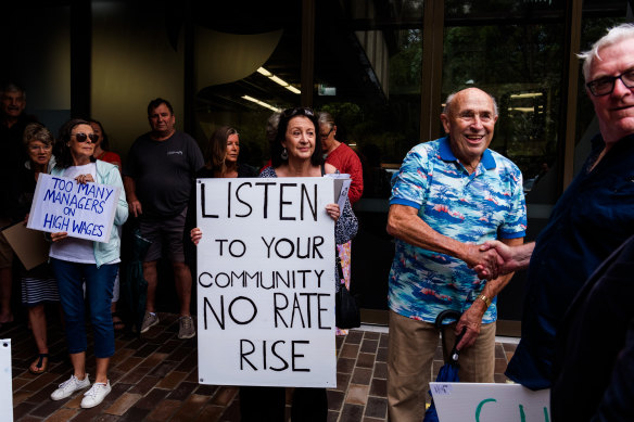Protesters gather outside the Northern Beaches Council meeting. 