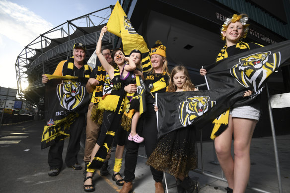 Tigers fans outside the Gabba, which will host the AFL grand final this year. Left to right: Paul Jones, Reeve McLennan, Rebecca Keys, Suzie Rowe and daughters Alice, 8, and Sarah 3, and Ryley Linnell.