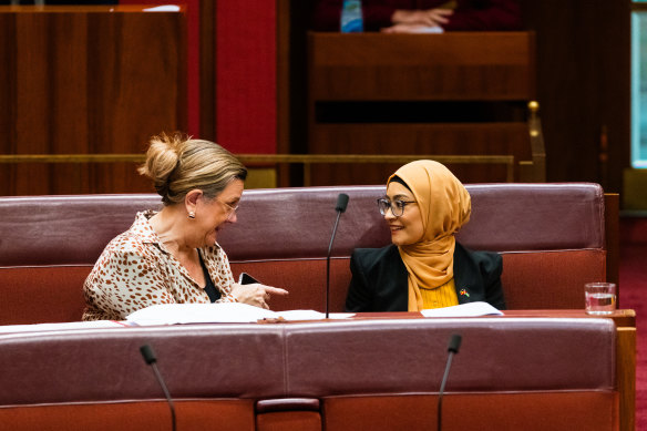 Independent senator Fatima Payman (right) sitting on the crossbench in the Senate this afternoon with Tasmanian senator Tammy Tyrell