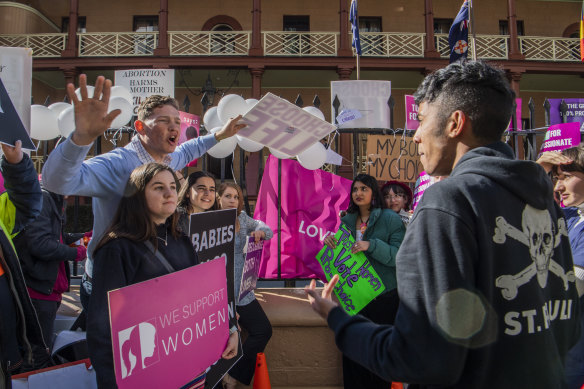 Anti-abortion and pro-choice campaigners protest outside NSW Parliament this week, as MPs debate an historic bill to decriminalise abortion. 