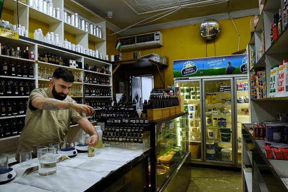 Ali Jalloul of Jalu Fragrances creates a bespoke fragrance in the rear of the family mixed business in Rockdale, NSW.