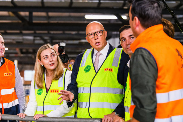 Peter Dutton campaigning in compulsory high-vis.