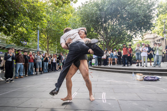 Gocchanko, an ex-sumo wrestler who now wrestles passersby for busking money. Here he lifts Monty Callan.