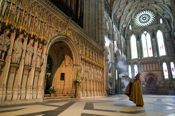 The Archbishop of York, Stephen Cottrell performs a blessing of York Minster’s Great Organ during the Easter Sunday Evensong service at the cathedral in York, England.