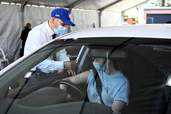 Belmore Medical GP Dr Jamal Rifi leading a drive-through vaccination clinic at Belmore Sport Ground in 2021.