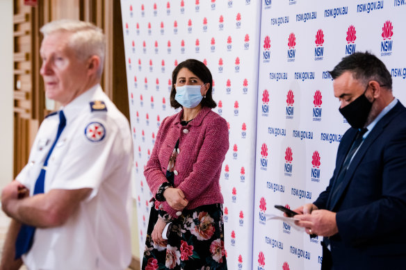 NSW Premier Gladys Berejiklian at Firday’s COVID-19 update, with NSW Ambulance Commissioner Dominic Morgan (left) and Deputy Premier John Barilaro (right).