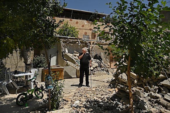 Fakhri Abu Diab among the ruins of his home in the Al-Bustan neighbourhood that was demolished by Israeli authorities in February last year.
