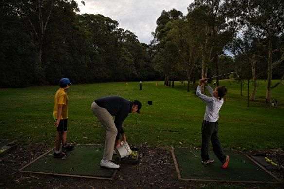 Young golfers at a coaching clinic ran by Brad Fasher at Lane Cove Country Club, which will be affected by a proposed new sporting complex.