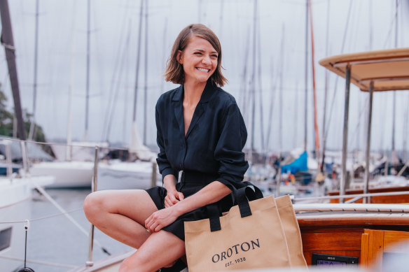 Jessica Watson with a new Oroton bag on board the Oroton Drumfire, which she’ll be sailing during this year’s Sydney to Hobart Yacht Race.