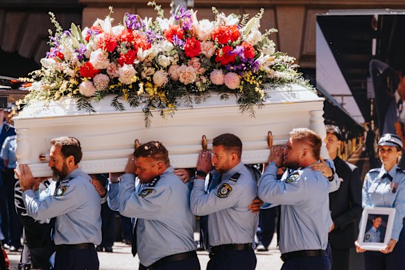 A police procession accompanies the casket of Constable Mia Lay as it enters St Andrew’s Cathedral in Sydney, including her partner, Daniel Vasquez (far right).