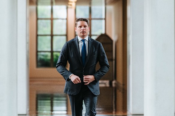 Andrew Hastie enters the Liberal Party meeting.