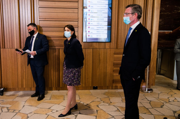 Premier Gladys Berejiklian (centre), Deputy Premier John Barilaro (left), Treasurer Dominic Perrottet (right) before a daily press briefing.