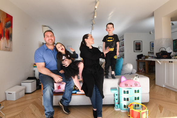 Adam and Kim Pisk with their children Daniel and Ava in their Double Bay apartment.