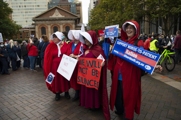 Wyong Hospital nurses came to the Sydney rally dressed as handmaids from the Margaret Atwood novel.