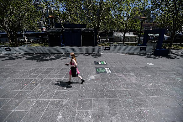 A woman walks through a near-deserted Southbank in Melbourne on Thursday morning. 