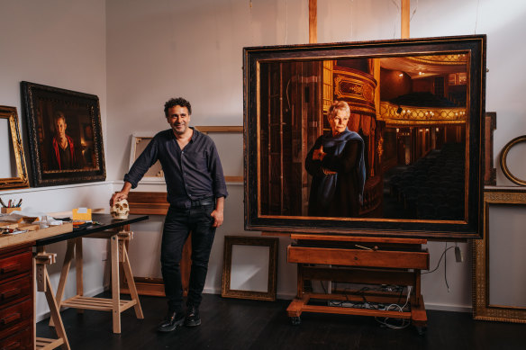 Heimans in his Bondi home studio with his portrait of Dame Judi Dench.