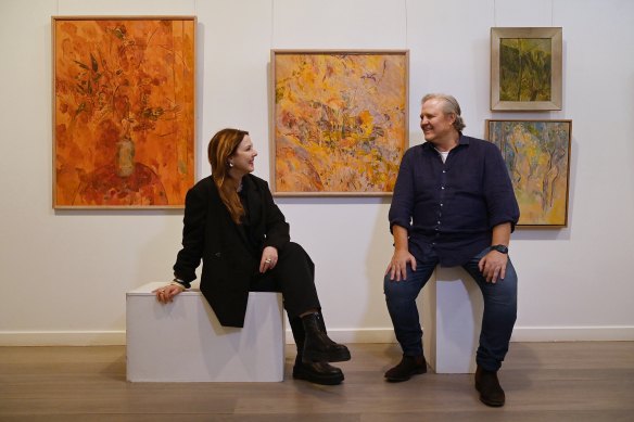 Louise Olsen (left) and brother Tim Olsen (right) with their mother Valerie Strong’s artwork.