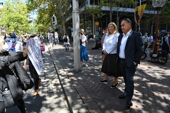 NSW Deputy Premier John Barilaro and Minister for Women Bronnie Taylor observe the protest in Sydney. 