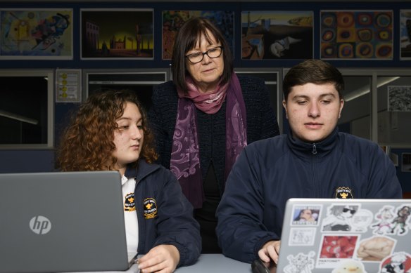 Rooty Hill High School Principal Chris Cawsey with year 10 students Owen Munday and Vanessa Stuparu. 