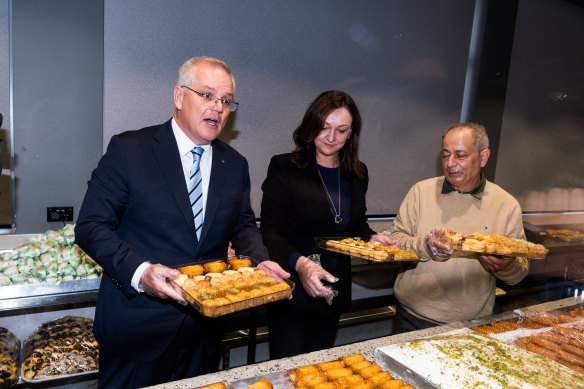 Prime Minister Scott Morrison and Parramatta candidate Maria Kovacic campaigning with business owner Milad Abla in Granville.