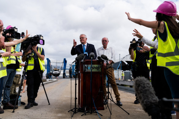 Prime Minister Scott Morrison answers questions at a shipyard in Cairns.