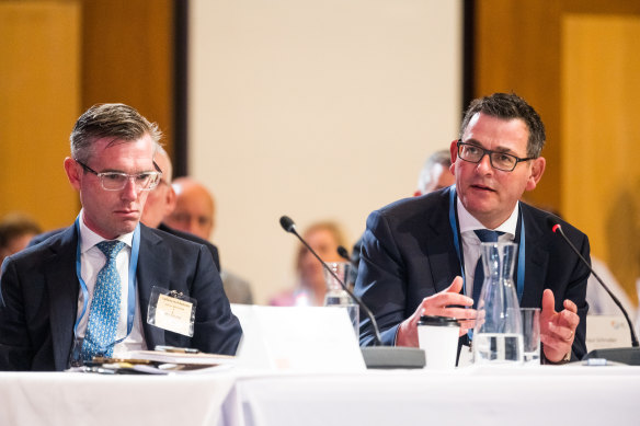 NSW Premier Dominic Perrottet and his Victorian counterpart Daniel Andrews at the federal government’s jobs summit on Friday.