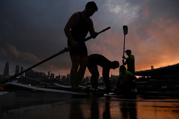 Glebe Rowing Club members prepare to skim the water at dawn. They are among hundreds of rowers and paddlers who use the bay in the early morning, afternoons and weekends.