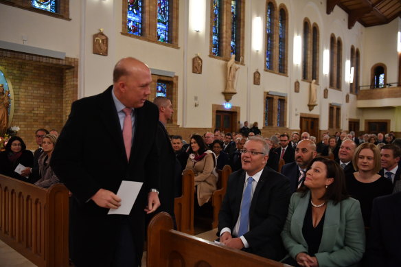  Peter Dutton alongside Prime Minister Scott Morrison and wife Jenny during a Parliamentary church service at the St Christopher’s Catholic Cathedral in Manuka, in Canberra in 2019.  