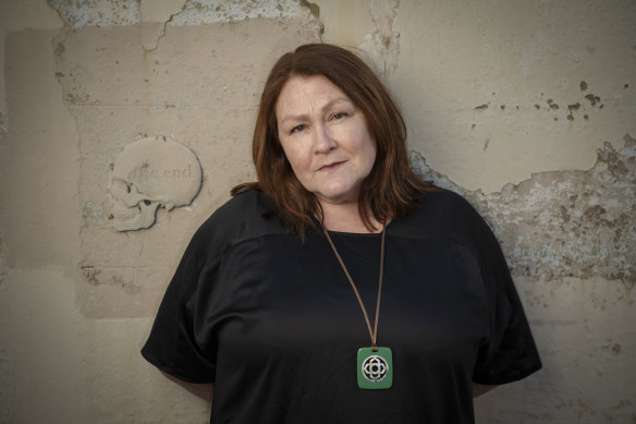 Sally Riley is amused by the symbolism of the skull on the laneway wall.