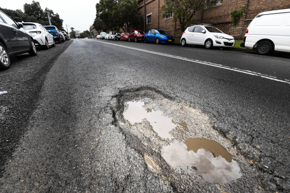 A pothole in Sydney during rains in July.