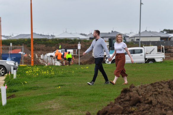 Amy Pullen and James Cowey inspecting the new estate where they will live. 