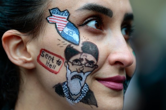A member of the Iranian community in Glasgow celebrates news of Ayatollah Ali Khamenei’s death.