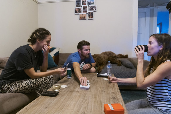 Flatmates Emily Logan, Chris Jackson and Brienna Anderson at home in Coogee.