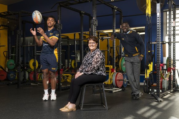 Retiring director of sport at Westfields Sports High Joanne Kenny with year 11 student Lorima Rokosuka (left) and year 12 student Rashid Kabba (right). 