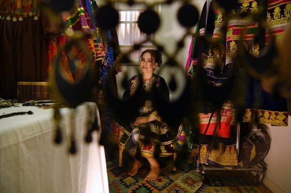 Lida Mangal wearing Afghan garments she has designed.