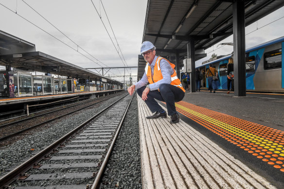 Stephen Webster of Integrated Recycling beside the recycled plastic sleepers his company supplied at Richmond station.