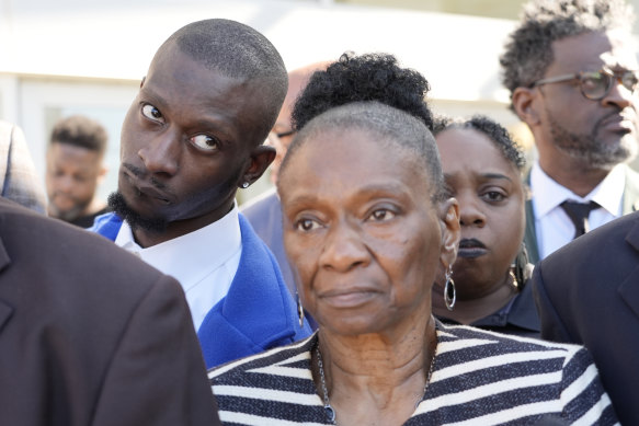 Michael Corey Jenkins stands with his mother Mary Jenkins outside court.