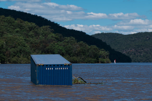 A shipping container wedged on a sandbar on the Hawkesbury River on Wednesday. 
