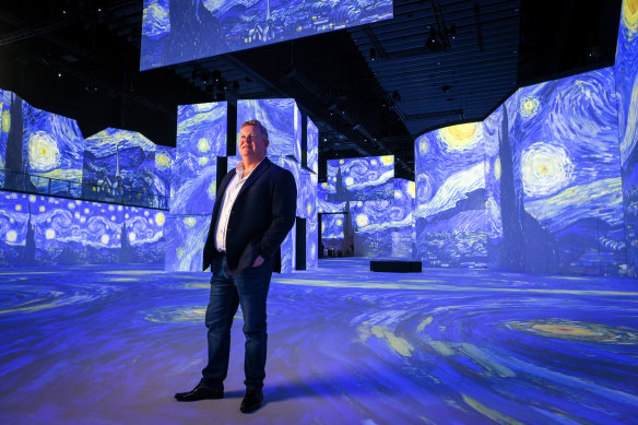 Founder of The Lume, Bruce Peterson, in front of the Vincent Van Gogh exhibition that opened The Lume in Melbourne.  