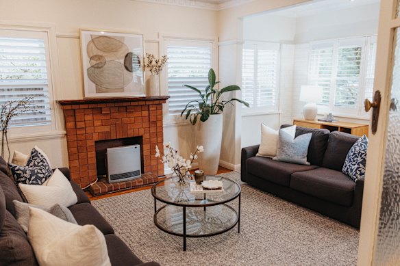 The three-bedroom 1930s home in Roseville has been gently updated while retaining its original features, including the brick fireplace and patterned ceilings.