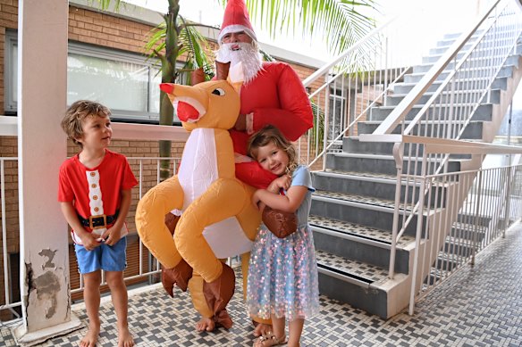 Margie "Santa" Charlton dressed up and delivered presents in her Newport unit block to children who couldn't see their extended families. 