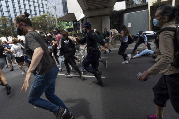 Police respond to a protest over fee rises at Sydney University on Wednesday.