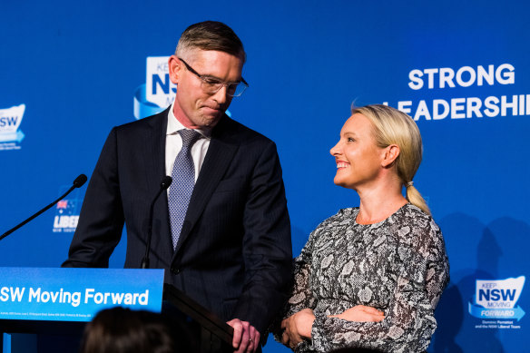 Dominic Perrottet, with his wife Helen, delivers his concession speech on Saturday night.