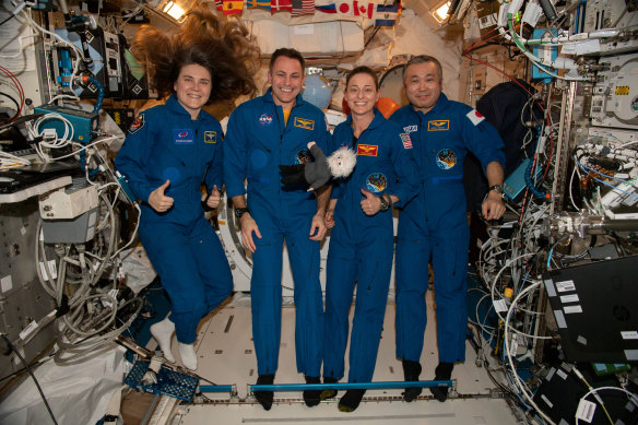 From left, ISS flight engineers from Roscosmos, NASA and Japan’s Aerospace Exploration Agency before their return to Earth in March.