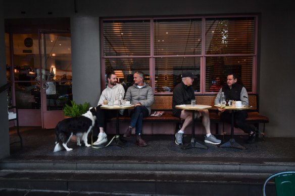 George and Peter Larsen (left) sat down for a coffee at Gilson in South Yarra after restrictions eased on Friday.
