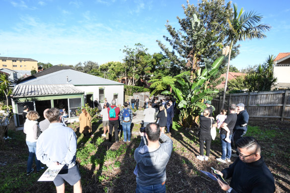 There were more onlookers than registered bidders as the run down home was going under the hammer for the first in 43 years.